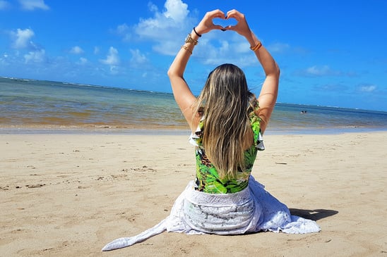 woman sitting on the beach